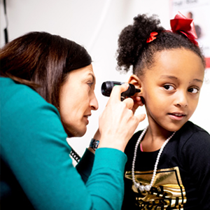 Dr. Noor examines a patient