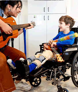 a patient enjoys a guitar therapy session