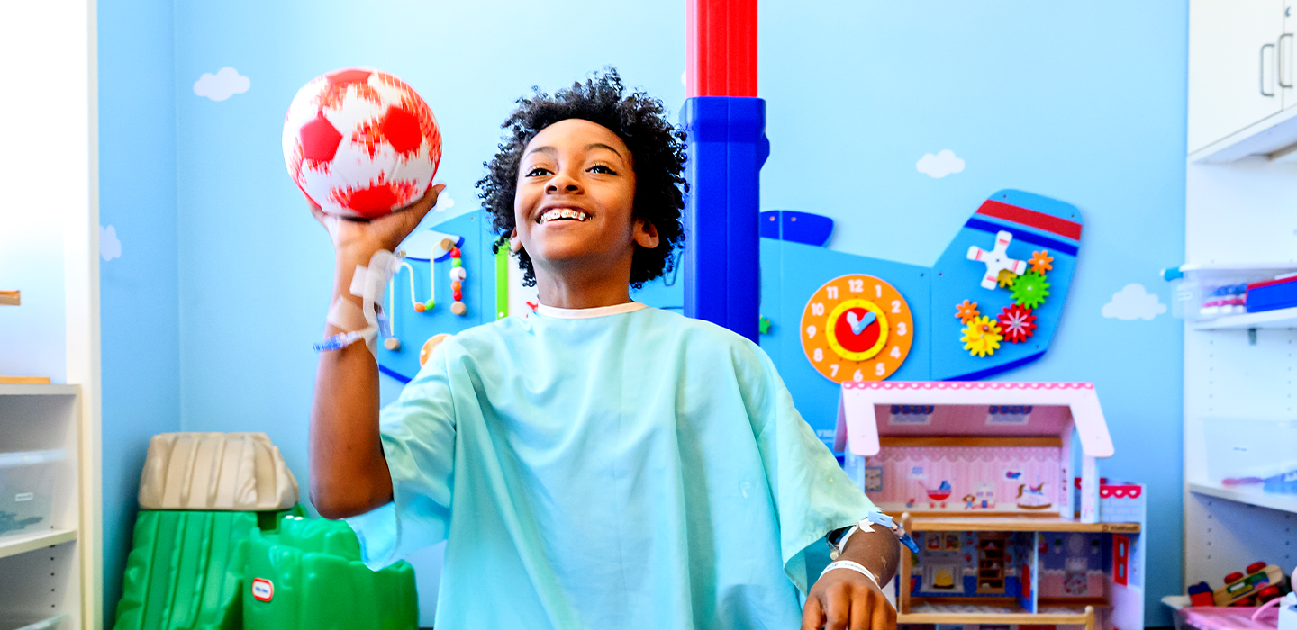 A patient plays with a ball in his room