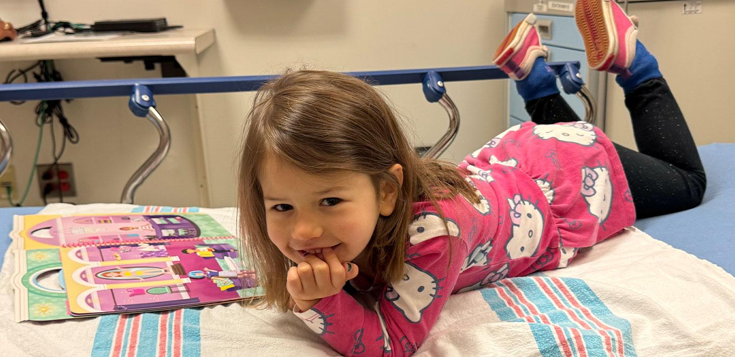 Charlie smiles in her patient bed