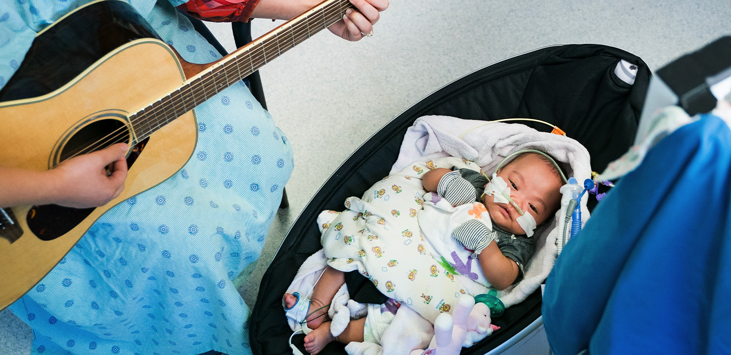 nicu patient with music therapist