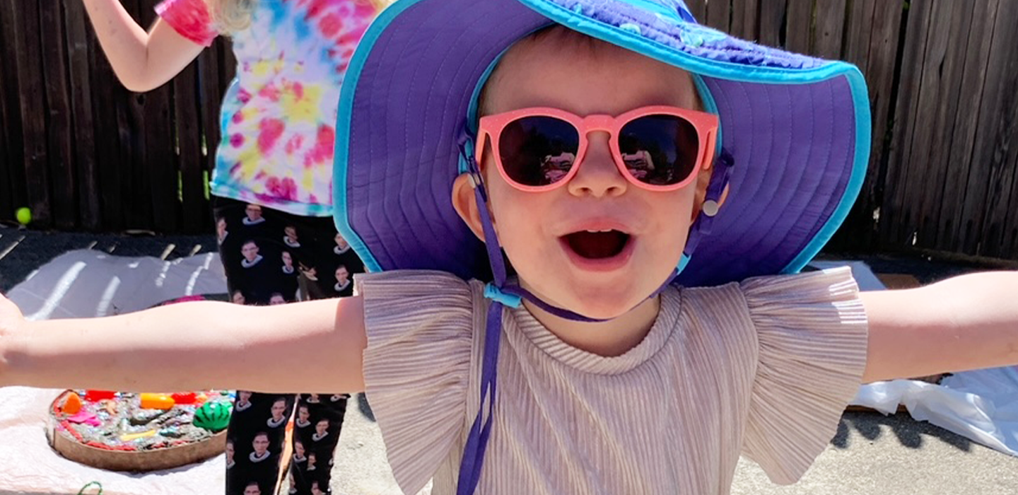 UCSF patient Rory smiling in her sunglasses