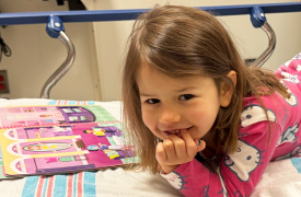 Charlie smiles in her patient bed