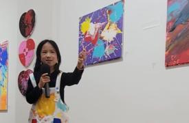 Juliette explaining her art