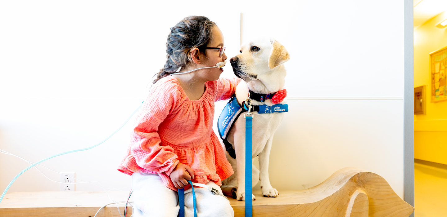 a patient and therapy dog share a moment